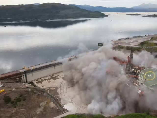 Striking footage shows a decommissioned oil rig being demolished with a controlled explosion, at Kishorn Port Limited's dry dock facility in Strathcarron, Wester Ross, Scotland