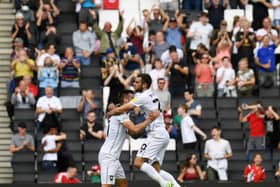 Troy Parrott celebrates his first Dons goal