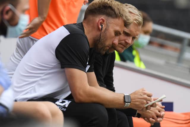 Chris Hogg admitted he was more than happy to remain at Newcastle United, working in their academy, but said as soon as Liam Manning called him to take up a role at MK Dons, he jumped at the opportunity