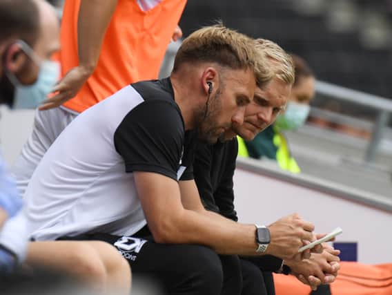 Chris Hogg admitted he was more than happy to remain at Newcastle United, working in their academy, but said as soon as Liam Manning called him to take up a role at MK Dons, he jumped at the opportunity