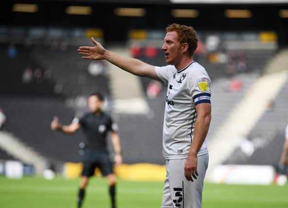 Dean Lewington is set to make his 700th league appearance for MK Dons on Saturday