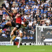 Portsmouth’s Marcus Harness battles with Daniel Harvie during Dons’ 1-0 win over Portsmouth at Stadium MK