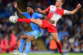 David Wheeler, who famously scored the goal to earn MK Dons promotion to League One in 2019, in action against Manchester City’s Raheem Sterling in the week during Wycombe Wanderers’ 6-1 humbling in the Carabao Cup