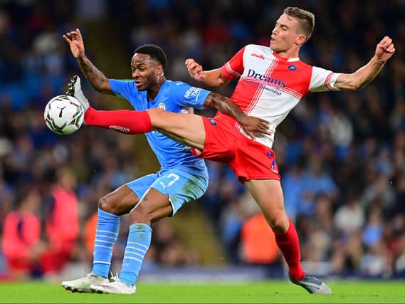 David Wheeler, who famously scored the goal to earn MK Dons promotion to League One in 2019, in action against Manchester City’s Raheem Sterling in the week during Wycombe Wanderers’ 6-1 humbling in the Carabao Cup