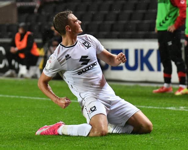 Scott Twine celebrates his hat-trick goal after a brilliant free-kick put MK Dons 3-2 up against Fleetwood on Tuesday night.