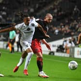 David Kasumu said his injury could not have come at a worse time, missing the first 10 games of the season, but he is now back and raring to go for MK Dons 