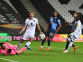 Warren O’Hora’s career at MK Dons has gone from strength-to-strength since signing for the club in summer 2020, initially on loan from Brighton