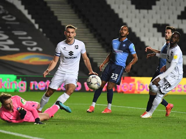 <p>Warren O’Hora’s career at MK Dons has gone from strength-to-strength since signing for the club in summer 2020, initially on loan from Brighton</p>
