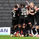 Rotherham celebrate Dan Barlaser’s goal which put them 2-0 up against MK Dons on Saturday. 
