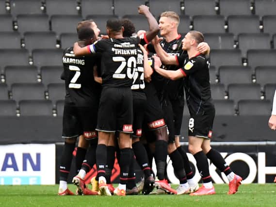 Rotherham celebrate Dan Barlaser’s goal which put them 2-0 up against MK Dons on Saturday.