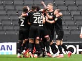 Rotherham celebrate Dan Barlaser’s goal which put them 2-0 up against MK Dons on Saturday. 