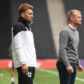 Chris Hogg (L) and Liam Manning watch on during MK Dons’ 3-0 defeat to Rotherham on Saturday. Manning said he will make changes for the visit of Aston Villa U21s on Tuesday.