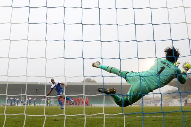 Lee Nicholls saves Tyrone Barnett’s penalty