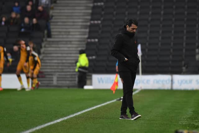 A dejected Russell Martin walks back to the bench after Port Vale opened the scoring