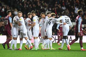 MK Dons celebrate scoring against Aston Villa U21s in the Papa John’s Trophy