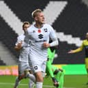 Harry Darling celebrates his goal against Stevenage in the FA Cup. Taking on his former club Cambridge on Saturday, he hopes MK Dons come out on top