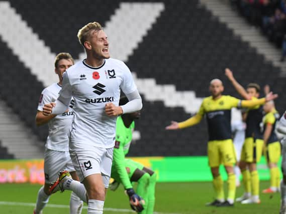 Harry Darling celebrates his goal against Stevenage in the FA Cup. Taking on his former club Cambridge on Saturday, he hopes MK Dons come out on top