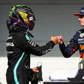 Lewis Hamilton and Max Verstappen bump fists after nearly bumping wheels at the Sao Paulo Grand Prix on Sunday