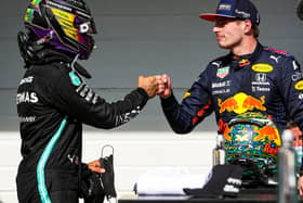 Lewis Hamilton and Max Verstappen bump fists after nearly bumping wheels at the Sao Paulo Grand Prix on Sunday