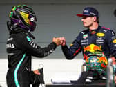 Lewis Hamilton and Max Verstappen bump fists after nearly bumping wheels at the Sao Paulo Grand Prix on Sunday