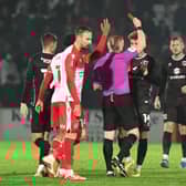 Referee Alan Young stunned everyone by sending off Josh Martin on the stroke of half-time as MK Dons were eventually beaten by Stevenage 2-1 at the Lamex Stadium