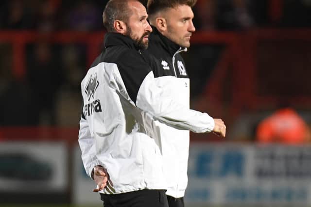 David Wright and Chris Hogg are in constant conversation during MK Dons matches