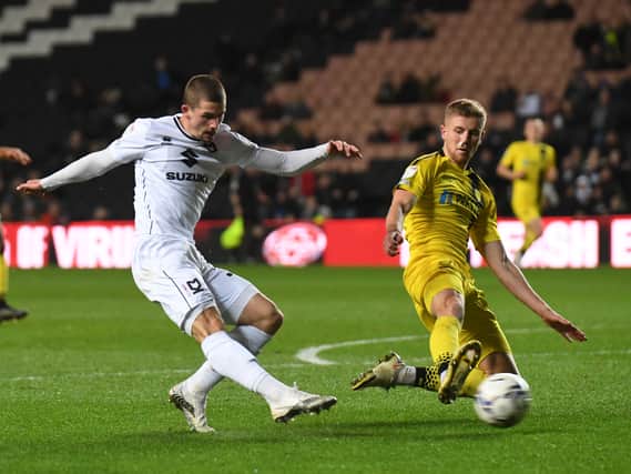 Max Watters fires in his seventh goal of the season in the 1-0 win over Burton Albion. Brewers boss Jimmy Floyd Hasselbaink said his side did not create enough chances at Stadium MK to win the game