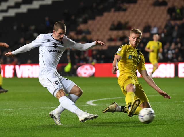 <p>Max Watters fires in his seventh goal of the season in the 1-0 win over Burton Albion. Brewers boss Jimmy Floyd Hasselbaink said his side did not create enough chances at Stadium MK to win the game</p>