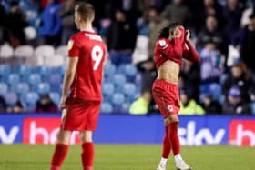 David Kasumu and Scott Twine look on in frustration after two late goals from Sheffield Wednesday see them overturn a 1-0 deficit with eight minutes to go at Hillsborough