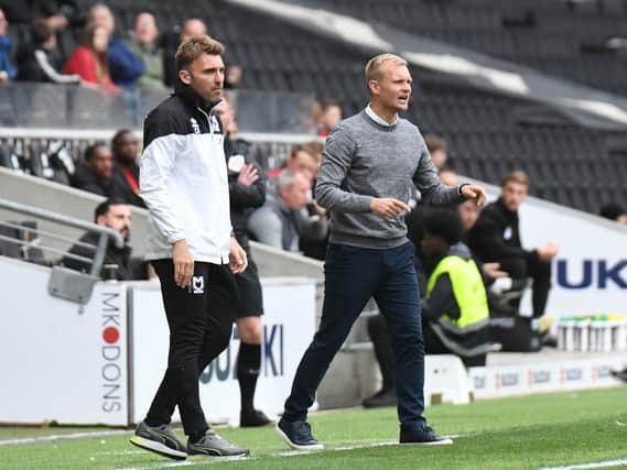 Liam Manning and Chris Hogg on the touchline for MK Dons