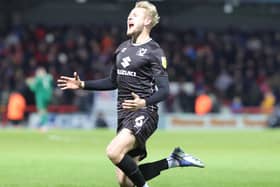 Harry Darling saw the ball perfectly onto his head as he put Dons 3-0 up at Morecambe - he didn’t see the knee-slide celebration falling flat though!