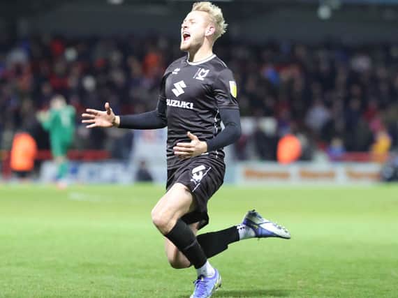 Harry Darling saw the ball perfectly onto his head as he put Dons 3-0 up at Morecambe - he didn’t see the knee-slide celebration falling flat though!