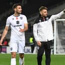 Assistant head coach Chris Hogg said  MK Dons will be fielding a side they believe can see off League Two side Leyton Orient in the Papa John’s Trophy 