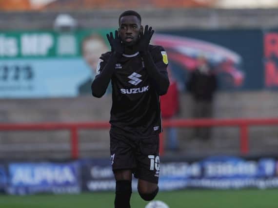 Mo Eisa celebrates a typical Mo Eisa goal against Morecambe