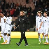 MK Dons will discover their Papa John’s Trophy opponents on Saturday