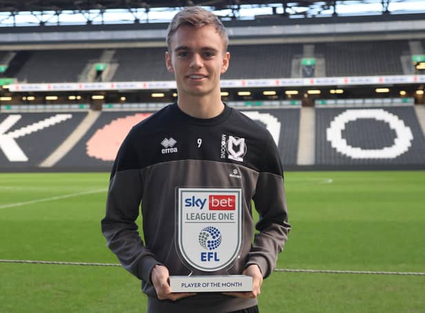 <p>Scott Twine with his Player of the Month trophy after winning the prize for November</p>