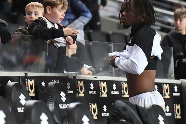 Peter Kioso with a young MK Dons fan