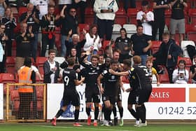 MK Dons celebrate Hiram Boateng’s late equaliser when the sides last met back in September