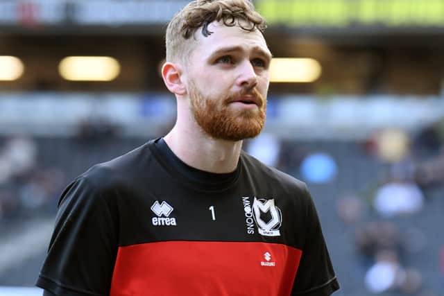 Andrew Fisher and MK Dons team-mate Matt O’Riley have been strongly linked with a reunion with former boss Russell Martin at Swansea City 