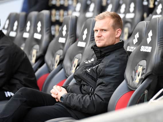 Liam Manning wants his players to aspire to play at a higher level, but he doesn’t see why those ambitions cannot be reached at MK Dons
