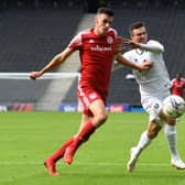 Daniel Harvie battles for the ball in the reverse fixture between MK Dons and Accrington earlier this season