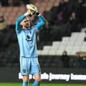 Andrew Fisher’s departure from MK Dons has been confirmed, signing for Swansea City