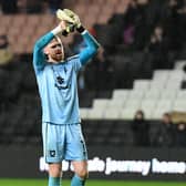 Andrew Fisher’s departure from MK Dons has been confirmed, signing for Swansea City
