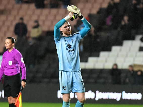 Andrew Fisher’s departure from MK Dons has been confirmed, signing for Swansea City