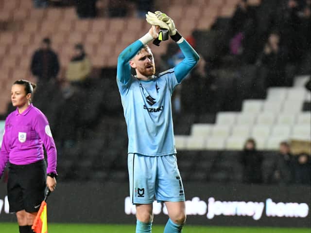 <p>Andrew Fisher’s departure from MK Dons has been confirmed, signing for Swansea City</p>