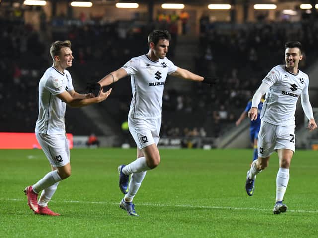 <p>Matt O’Riley celebrates his second career goal against AFC Wimbledon</p>