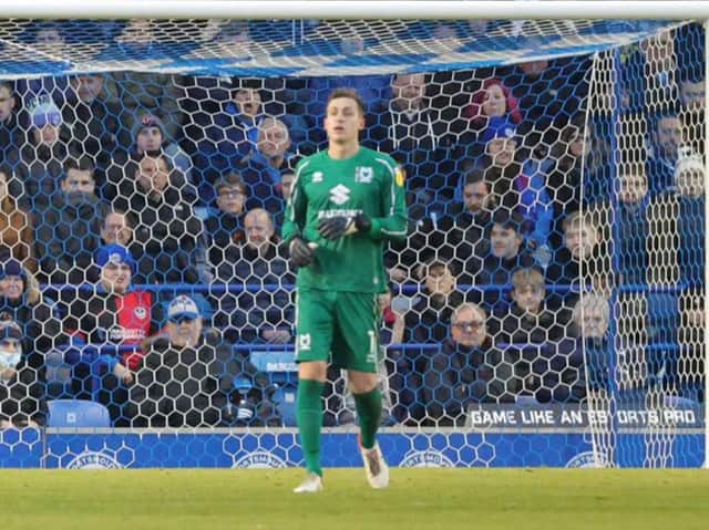 <p>Jamie Cumming made a strong start to life at MK Dons with a great showing against Portsmouth at Fratton Park</p>