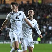 Matt O’Riley celebrates his goal against AFC Wimbledon in what turned out to be his penultimate game for MK Dons