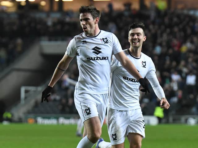 <p>Matt O’Riley celebrates his goal against AFC Wimbledon in what turned out to be his penultimate game for MK Dons</p>