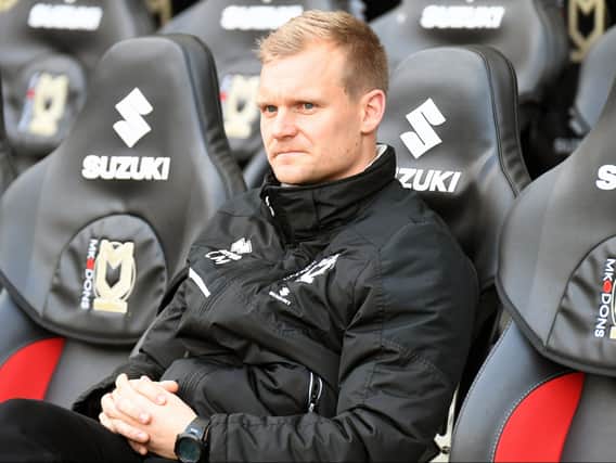 Liam Manning said he is not trying to mould MK Dons into a squad in his vision but one for the long-term view of the club